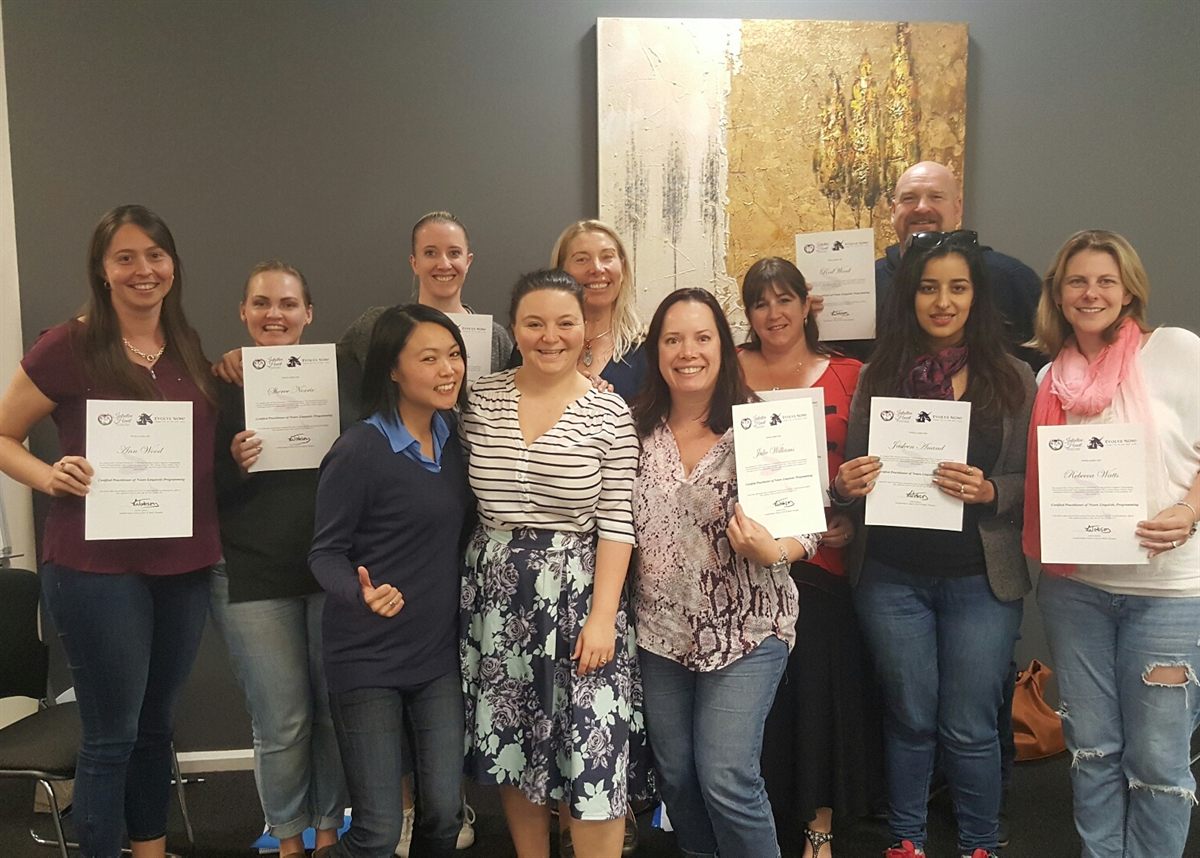 Intuitive Heart Training Academy graduates holding their certificates