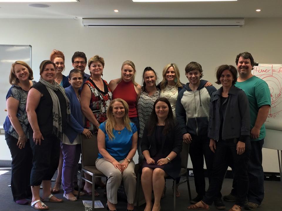 Lauren seated with an IHTA training group