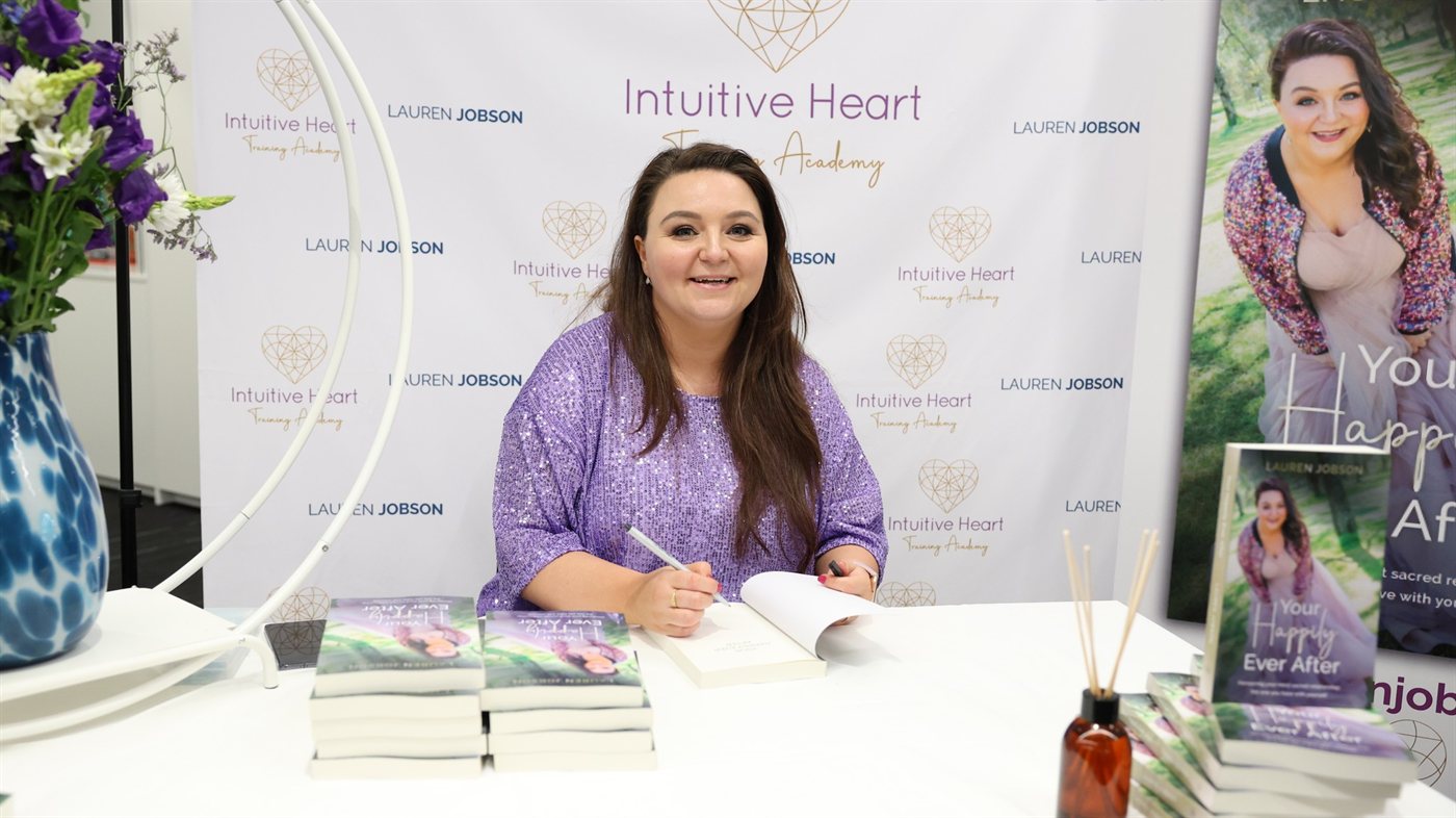 Lauren Jobson signing copies of her book Your Happily Ever After