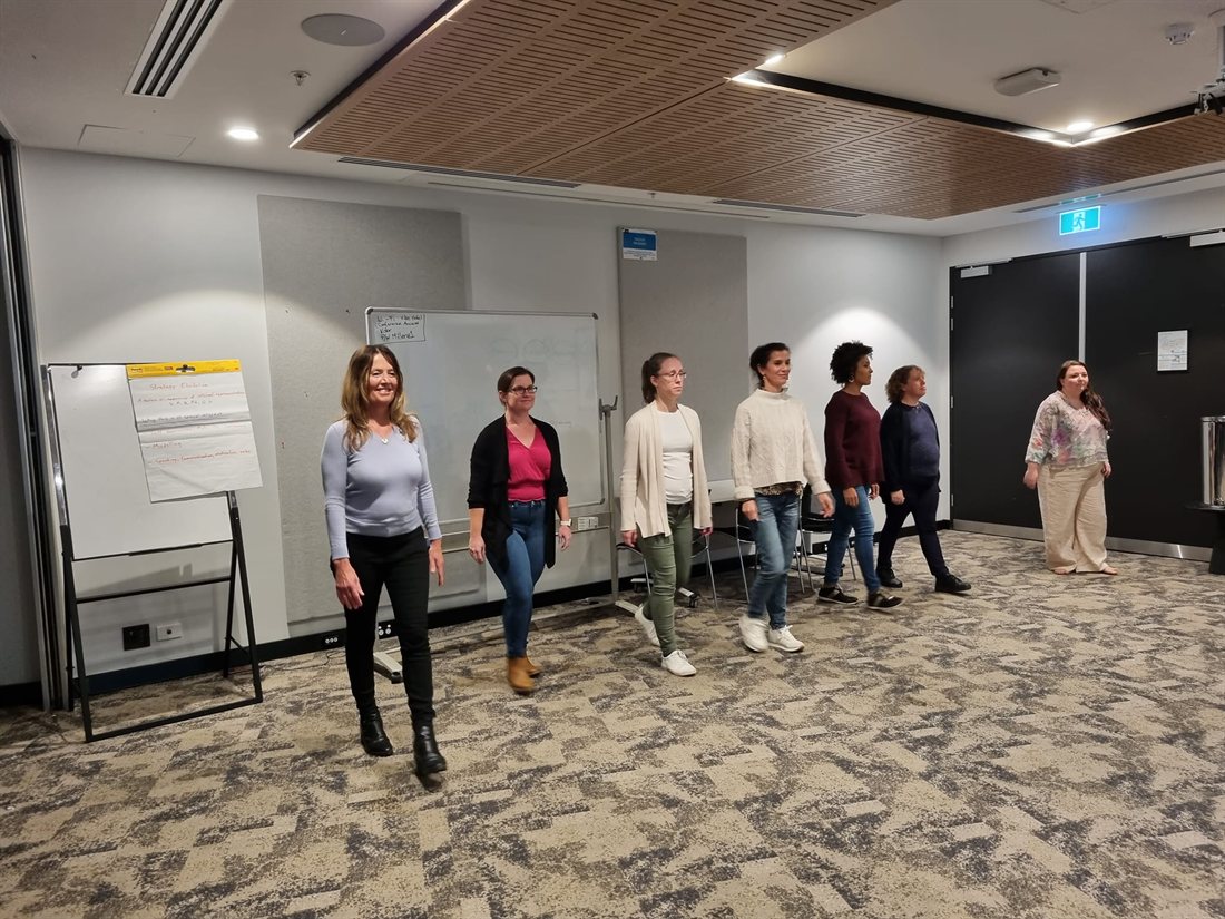 Lauren guiding a group through an exercise